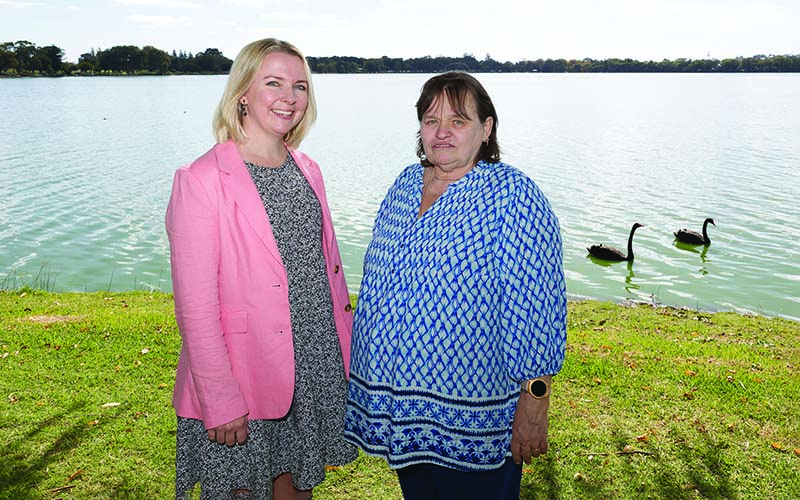 Dr Angela Fuery and Sharon Gregory standing by a river