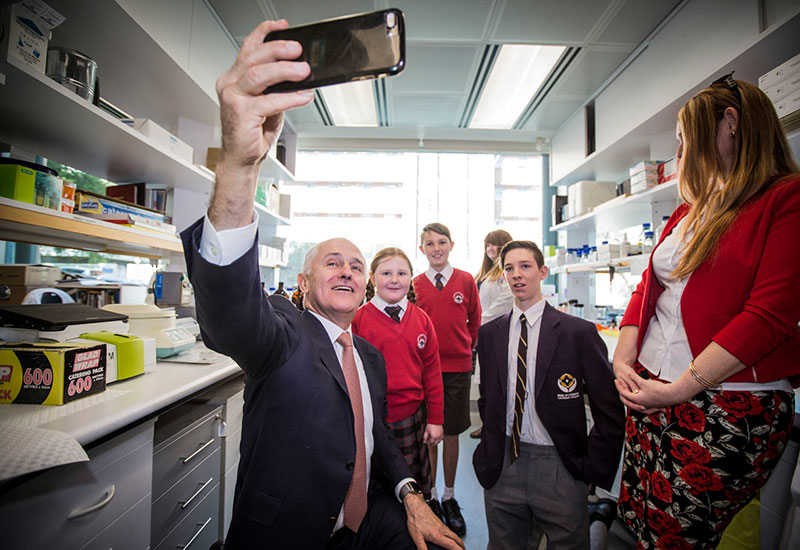 Australian Prime Minister Malcolm Turnbull takes a selfie with Sinead Engelbrecht and her family.