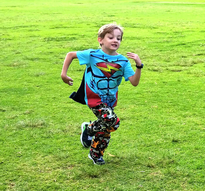 Dartanyon running, wearing superman t-shirt